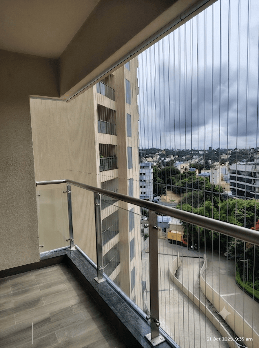Modern invisible safety grills for high-rise apartment balcony view