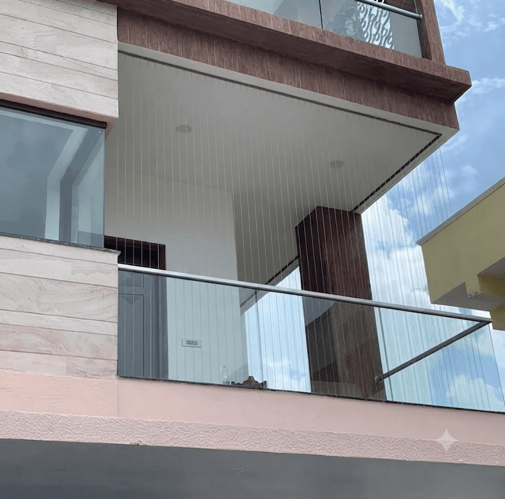 Sleek invisible safety grills with glass railing on luxury balcony