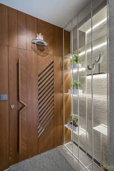 Modern wooden safety door featuring diagonal louvered ventilation pattern